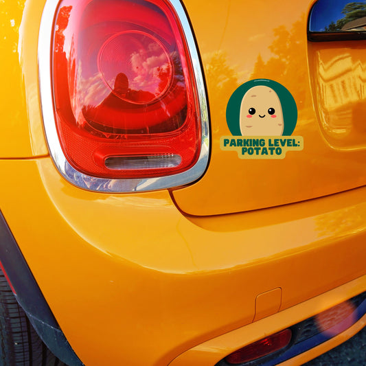 Humorous car sticker with text 'Parking Level: Potato' on orange Mini Cooper